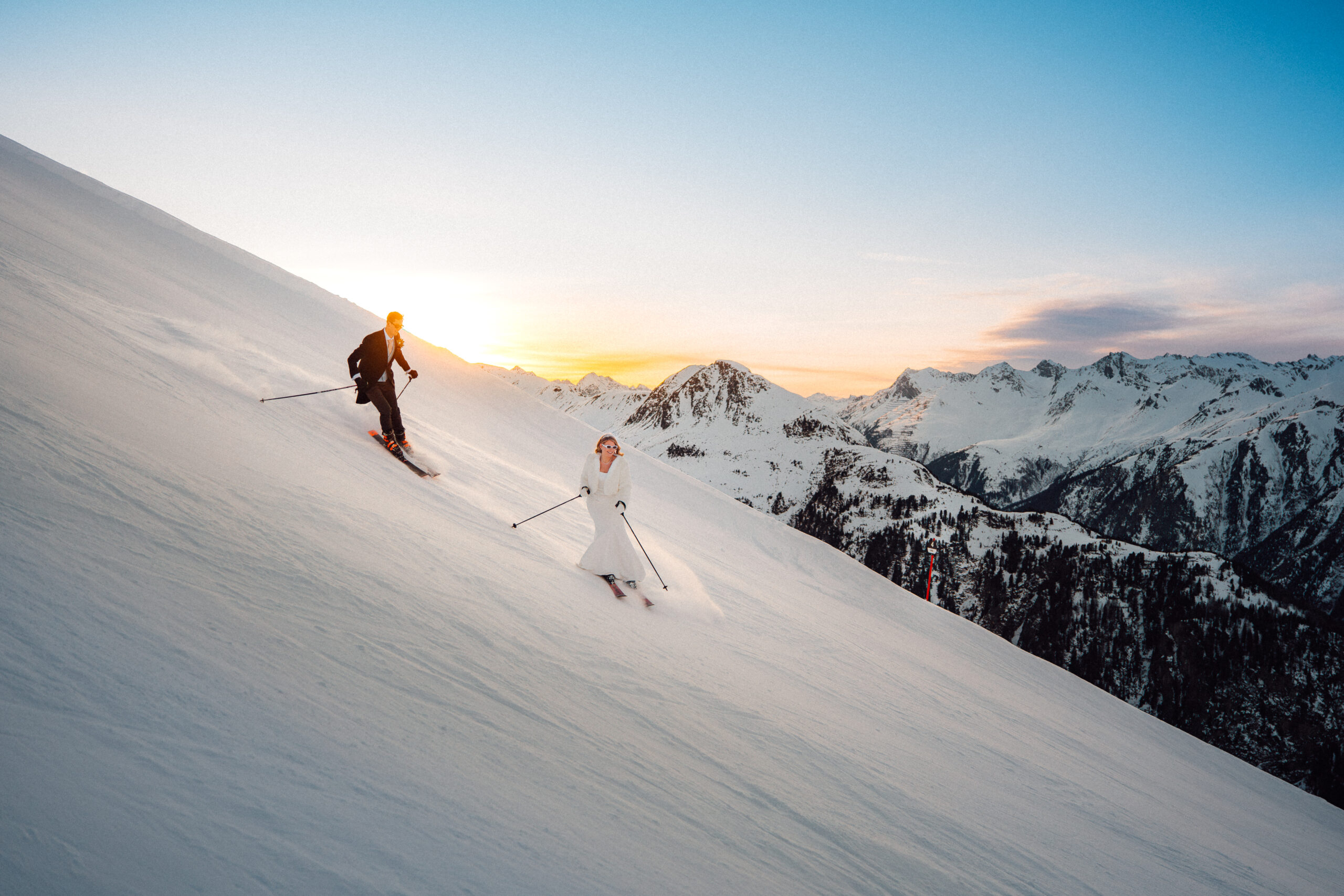 couple ski down from their mountaintop wedding in Ischgl