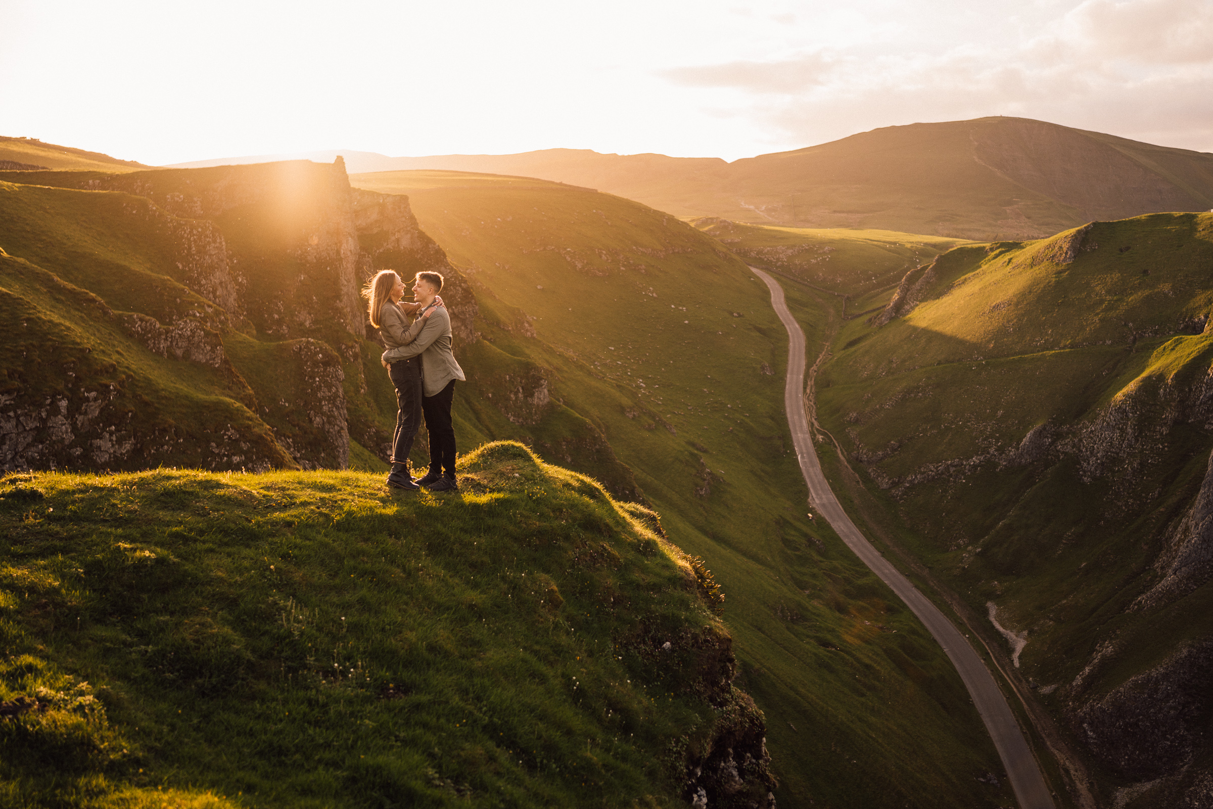Couple in Winnats Pass gorge, Peak District engagement photography - Bowl of Corks